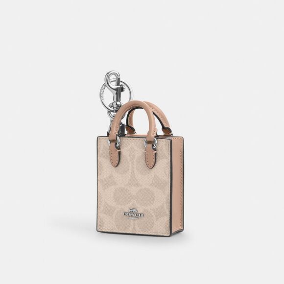 NWT Coach Outlet North/South Mini Tote Bag Charm In Signature Canvas - Picture 1 of 2